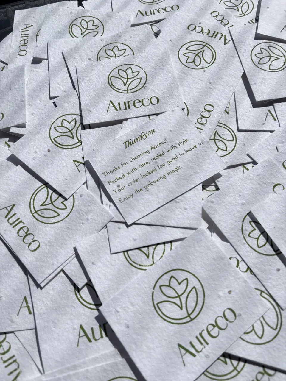 Branded thank you cards printed on textured card stock for a fashion brand order.